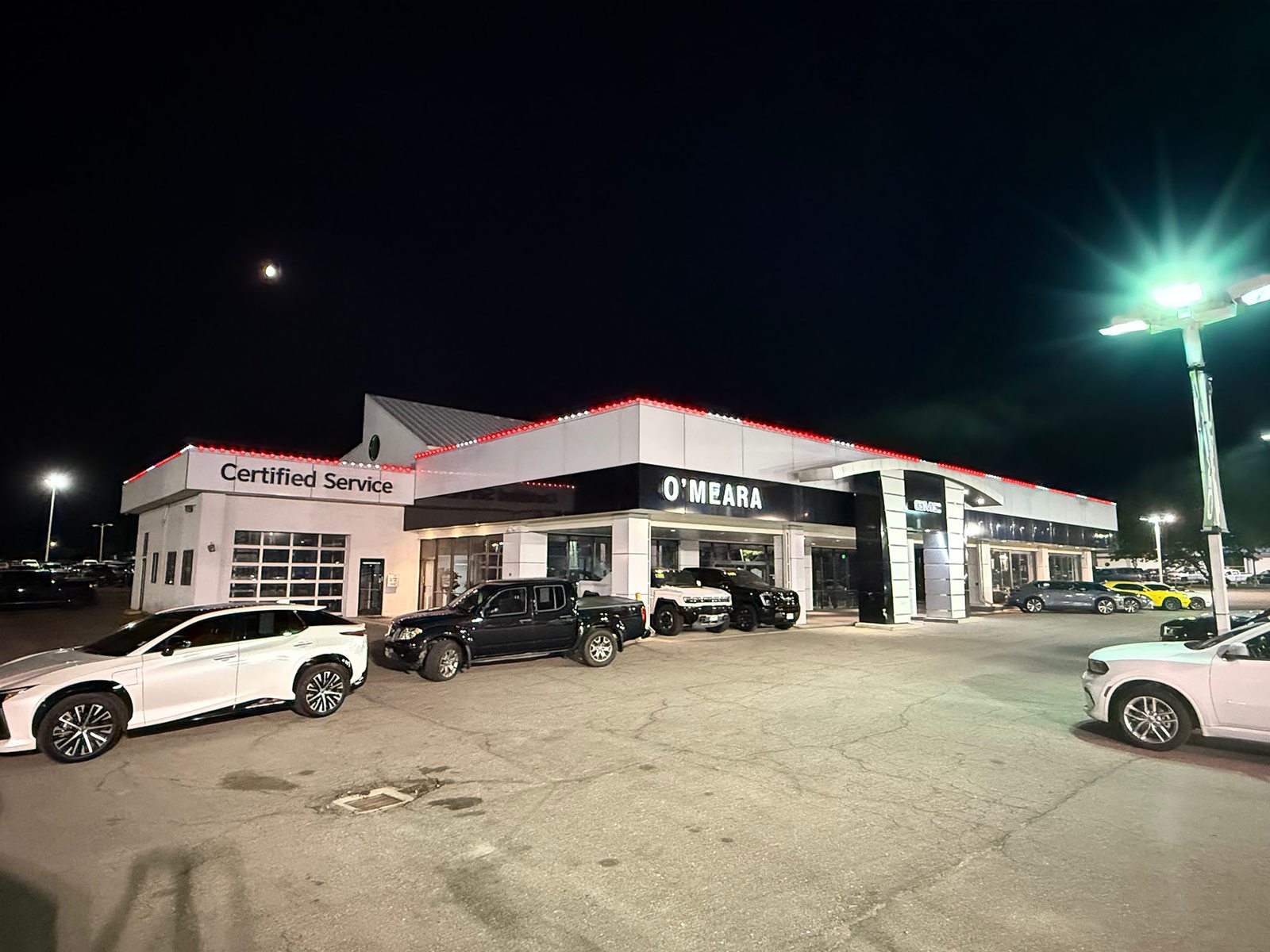 GMC dealership with permanent red and white lighting