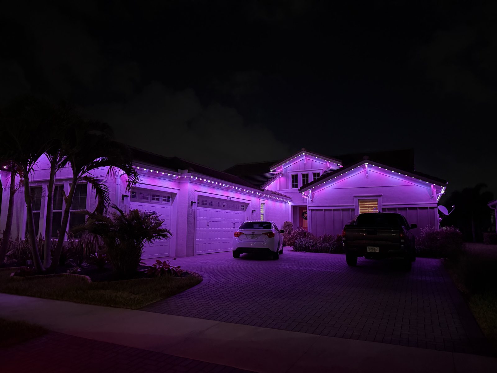 Home with red white and blue permanent roofline lighting