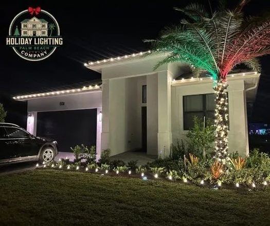 Home with red and white roofline lighting